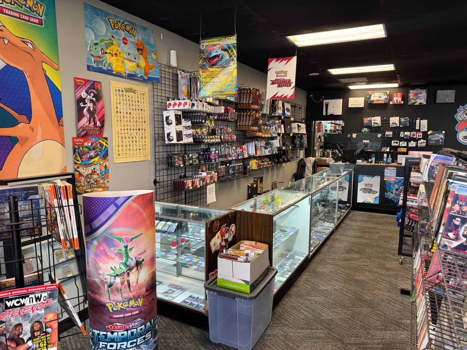 inside 8-Bit Legends pokemon card shop in Jonesboro Arkansas with pokemon tcg products and display cases