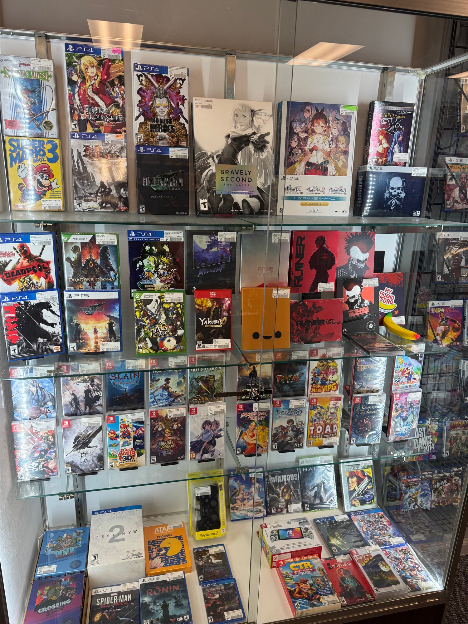 retro video games and collector edition games displayed in glass case at 8-Bit Legends retro video game store in Jonesboro Arkansas