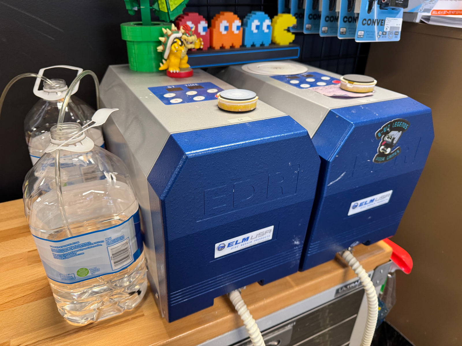 Professional video game disc resurfacing machine used to repair scratched discs at 8-Bit Legends Video Games in Jonesboro Arkansas